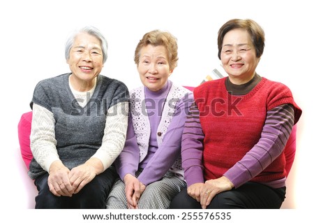 Three elderly women of good relationship with a smile
