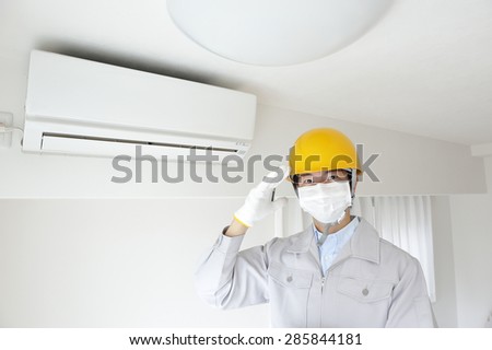 Men of work clothes that have air conditioning in inspection