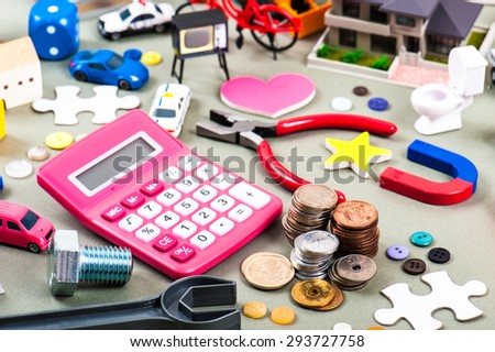 House model and a lot of objects, pink calculator