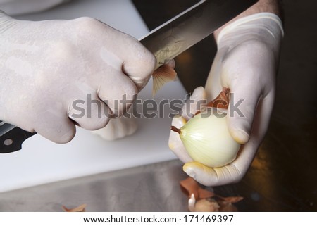 cleaning onions for cooking in the restaurant