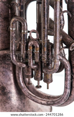 old pipe wind instrument, an old brass pipe