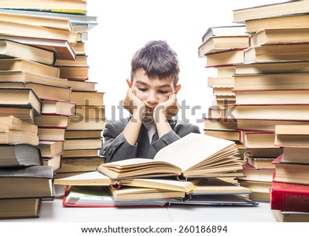 boy with enthusiasm reads the book in a vast body of literature