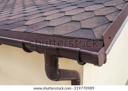 plastic drainage on the roof near the shingles