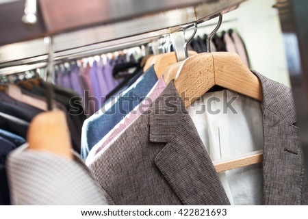 suits on hangers in store
