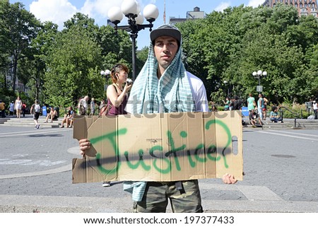 NEW YORK CITY - JULY 14, 2013: A protestor holds a \