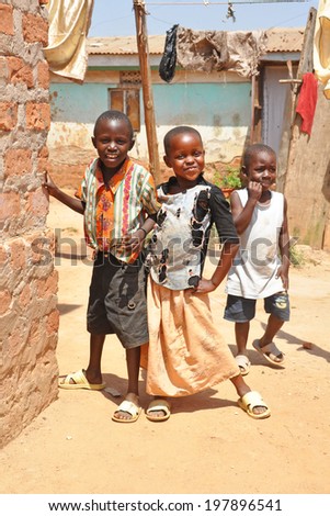 KAMPALA, UGANDA, AFRICA - CIRCA FEBRUARY 2009: Unidentified children living in the Kampala slums circa February 2009 in Uganda, Africa. Kampala is the largest city and capital of Uganda.