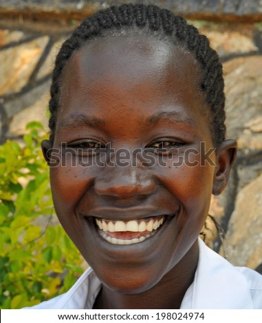 GULU, UGANDA, AFRICA - CIRCA MAY 2009: Portrait of a woman from Uganda, Africa circa May 2009. In Uganda, women's roles within the community are slowly improving with increased educational programs.