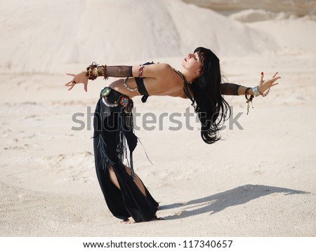 Tribal dance in sand
