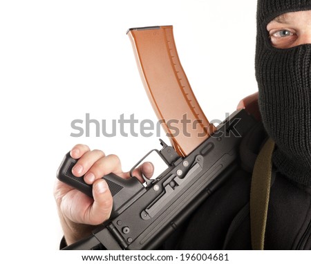 Man in mask with gun on white background