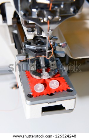 The machine for sewing on buttons of electric type of new generation