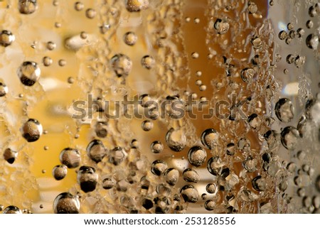 Textures of icy water bubbles  with colored background. Macro with shallow depth of field.