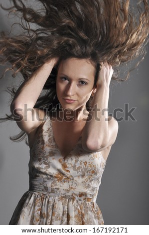 young girl throws back hair