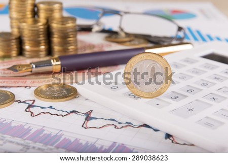 Business concept with calculator, glasses, money and documents