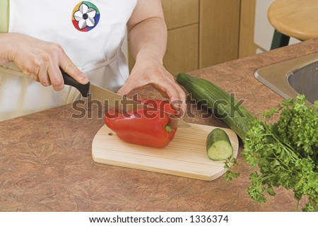cuting red pepper on kitchen board