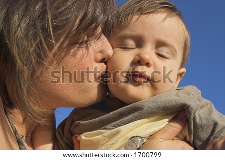 mother kissing her son