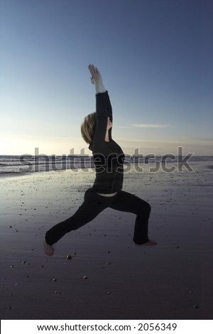 woman doing yoga on deserted beach - woman is transparent
