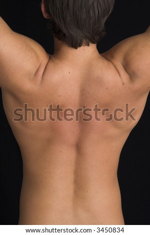 close up of a young man back over black background
