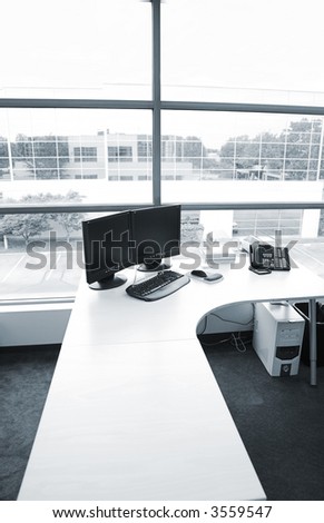wide angle of office desk in blue tone