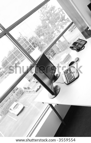 wide angle of office desk in black and white