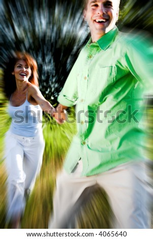 couple running in field - motion blur effect