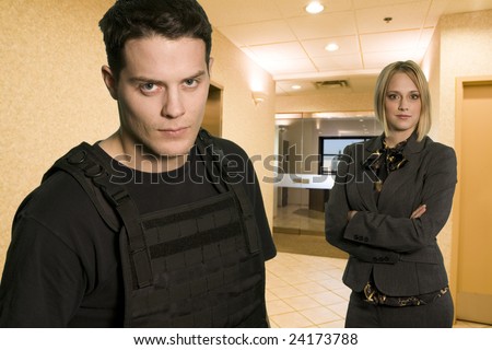 fbi agent in office wearing bullet proofed jacket