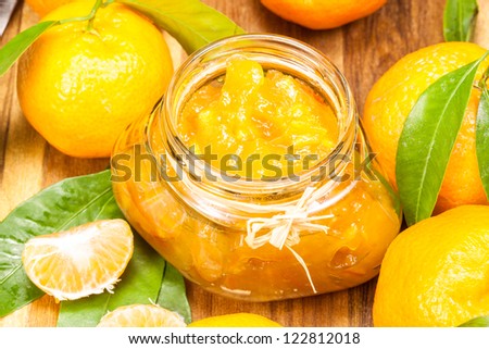 orange mandarin  jam or  marmalade in a glass jar