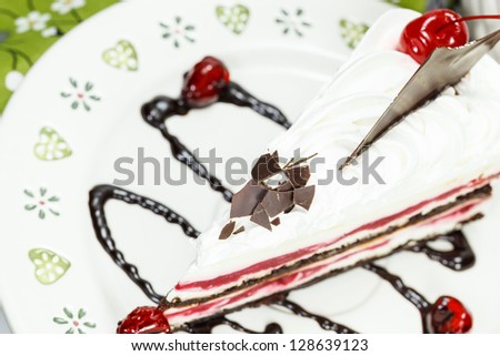 Black Forest Cake. Slice of chocolate black forest cake with a cherry