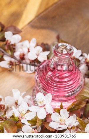 essential oil for aromatherapy. Bottle with essential oil and flowers. Copy space