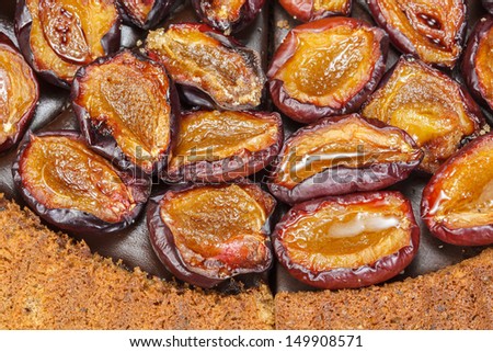 Plum tart. Plum cake with roasted cinnamon plums. Close up, macro. Above view