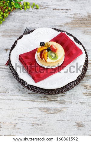 Fruit tart.  High angle view of fruit tart in a plate. Copy space composition