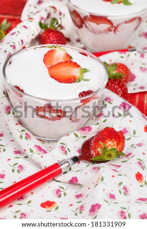 Strawberry Vanilla Panna Cotta. Panna Cotta with strawberries in a glass decorated with sliced strawberries. Macro, selective focus