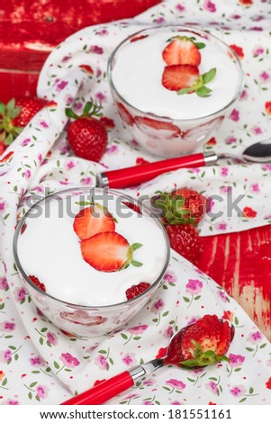 Strawberry Vanilla Panna Cotta. Panna Cotta with strawberries in a glass decorated with sliced strawberries. Macro, selected focus
