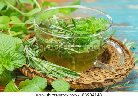 Herbal tea. Rosemary Mint Tea with fresh rosemary and mint leaves. Macro, selective focus