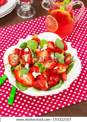 Strawberry Spinach Salad. Salad with strawberry, spinach leaves and feta cheese. Macro, selective focus