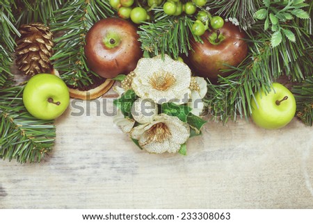 Christmas decoration. Green decoration with fruits. Done with soft vintage retro filter. Close up