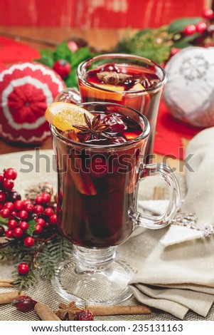 Christmas mulled wine. Delicious mulled wine with apple cider,  fruits and spices. A macro photograph with  shallow depth of field. Done with vintage retro filter.