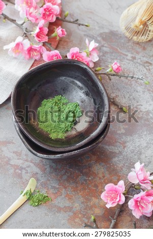 Matcha green tea . Still life with matcha green tea  and bamboo whisk. Japanese Tea Ceremony: Preparation of powdered green tea.Macro, selective focus. Natural light