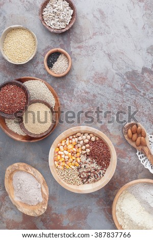 Gluten free grains and flours. Assorted  gluten free  grains in various containers , top view, blank space