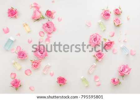 Natural skin care products. Spa setting with flowers and essential oils. Spa theme. Top view, blank space, white background