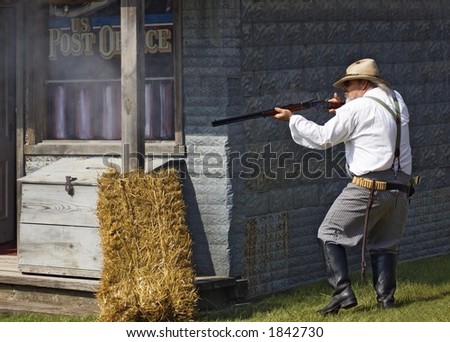 Shootout at the Post Office - Reenactor at shootout at the post office fires his rifle