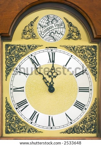 Ornate clock face with latin \