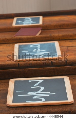 School Desk Row - slates and books on row of old school desks