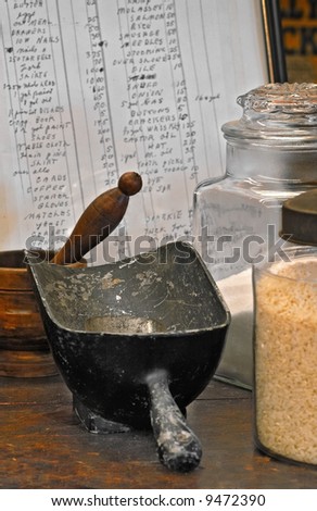 Old Time Store Display - general store, food items, scoop, mortar and pestle and price list in background