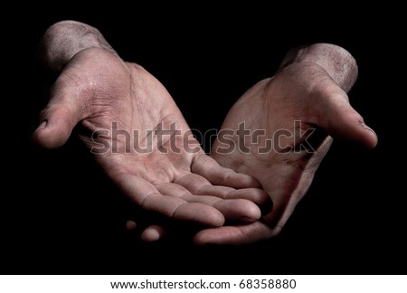 Dirty Outstretched Hands - Fingers closed Dirty outstretched male hands against black background - one hand laid on top of the other