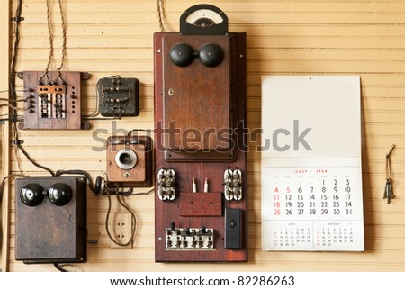 Wall of Telephone/Telegraph Equipment in Train Depot - vintage with 1954 calendar & keys