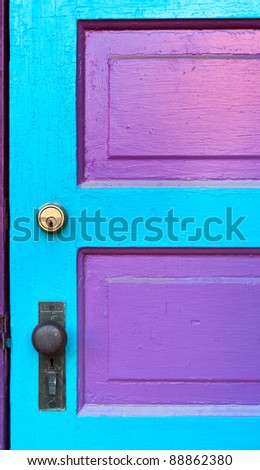 Pink & Cyan Door - old wooden door with old and new lock painted two colors