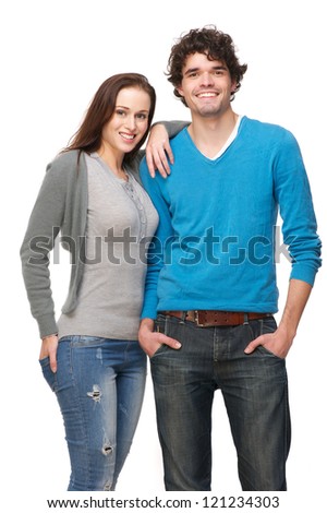 Young smiling happy couple isolated on white background Boyfriend and girlfriend are in a relaxed pose and laughing Young smiling happy couple isolated on white background Boyfriend and girlfriend are in a relaxed pose and laughing