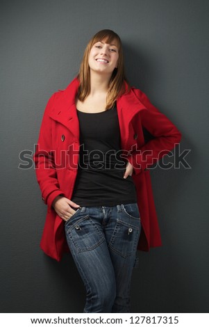 Portrait of a young woman in red jacket