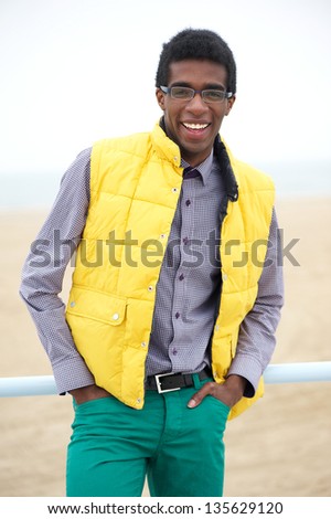 Portrait of a happy african american male fashion model in colorful clothing