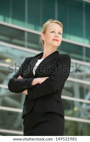Closeup portrait of a businesswoman posing outside office building